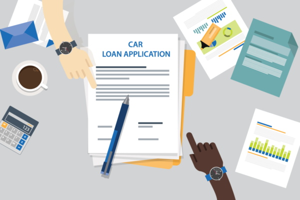 Two people pointing at a car loan pre-qualification document